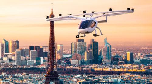 An eVTOL, also known as a flying car, flies past the Eiffel Tower in Paris.